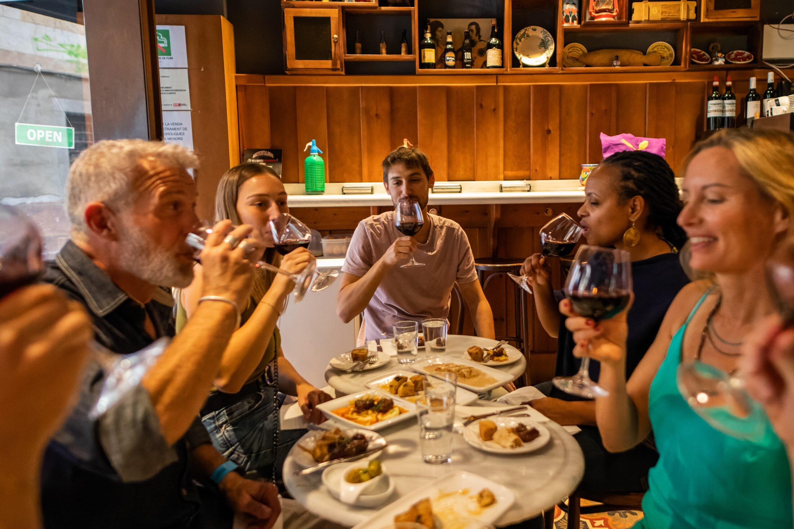 Vibrant tapas bar scene in Barcelona's Gothic Quarter with small plates and wine